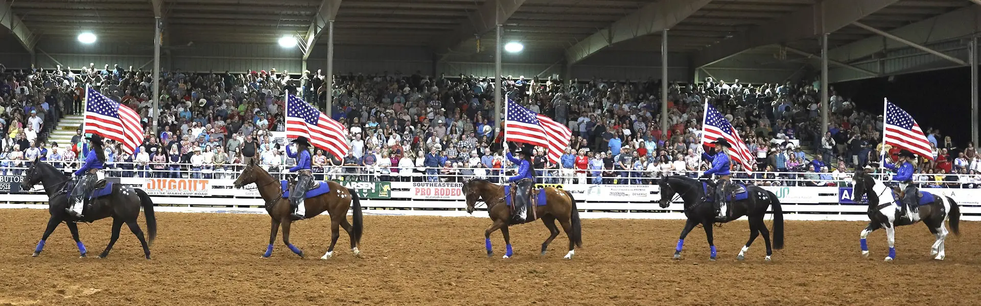 Ocala Pro Rodeo Rodeo Riders Holding American Flags
